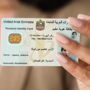 Buy UAE Residence Permit Online - PassportIDZone Close-up of a UAE resident identity card held by a hand with pink nails.